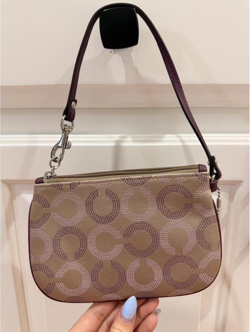 Coach Wristlet with Repeating Purple C Logo Pattern